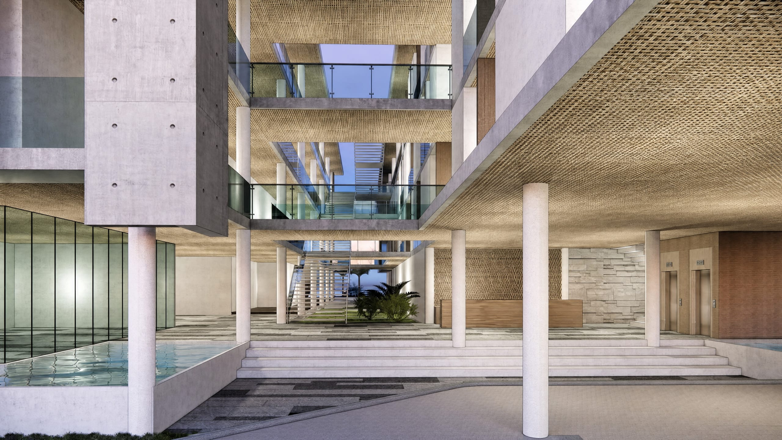 Resort atrium lobby with a reflecting pool and open stair