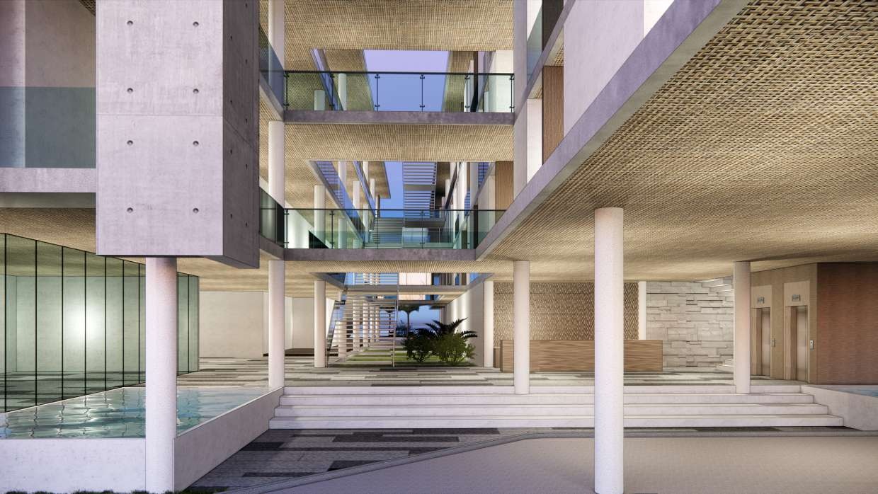 Resort atrium lobby with a reflecting pool and open stair