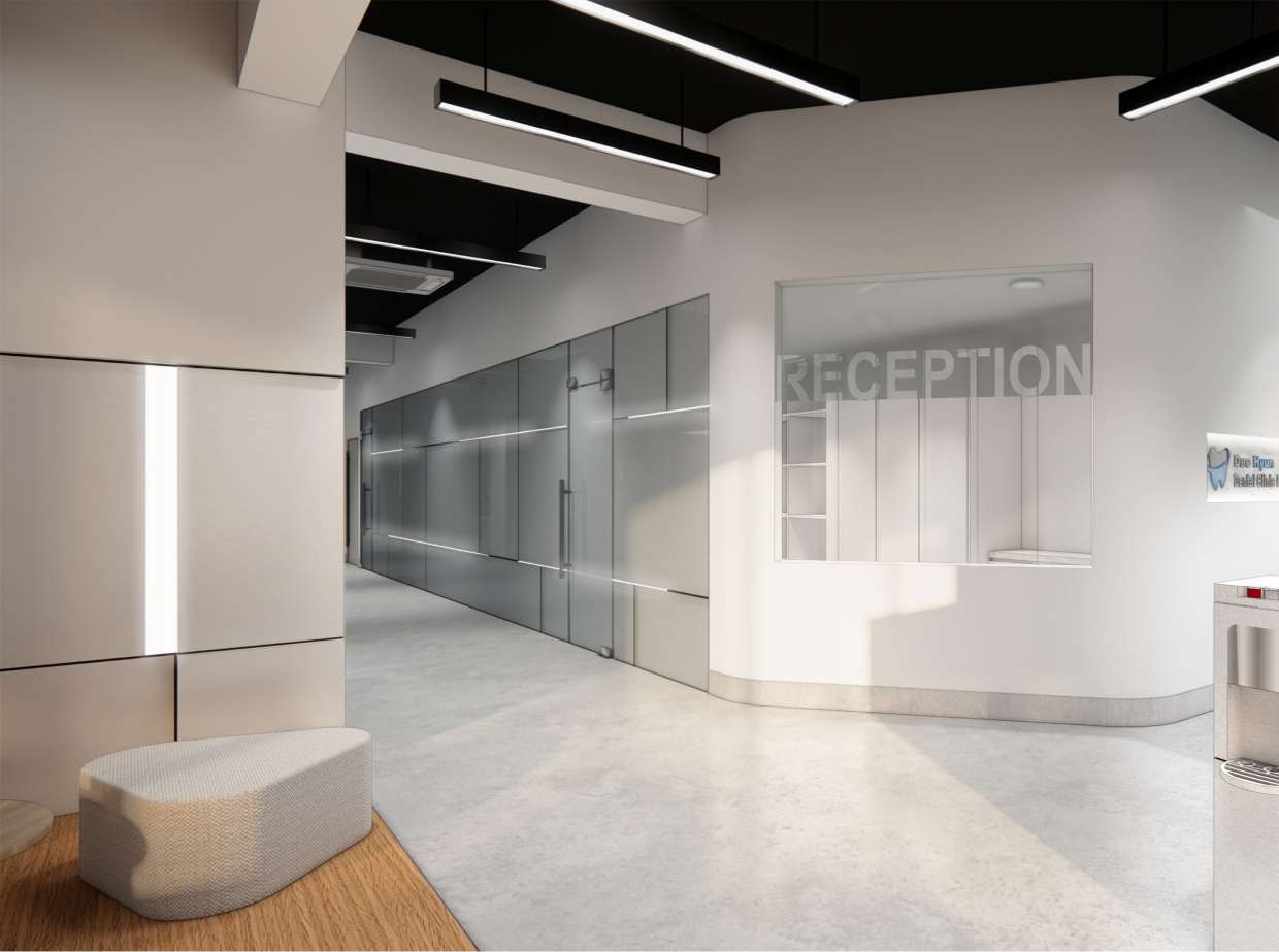 Dental clinic corridor leading to a frosted-glass reception desk