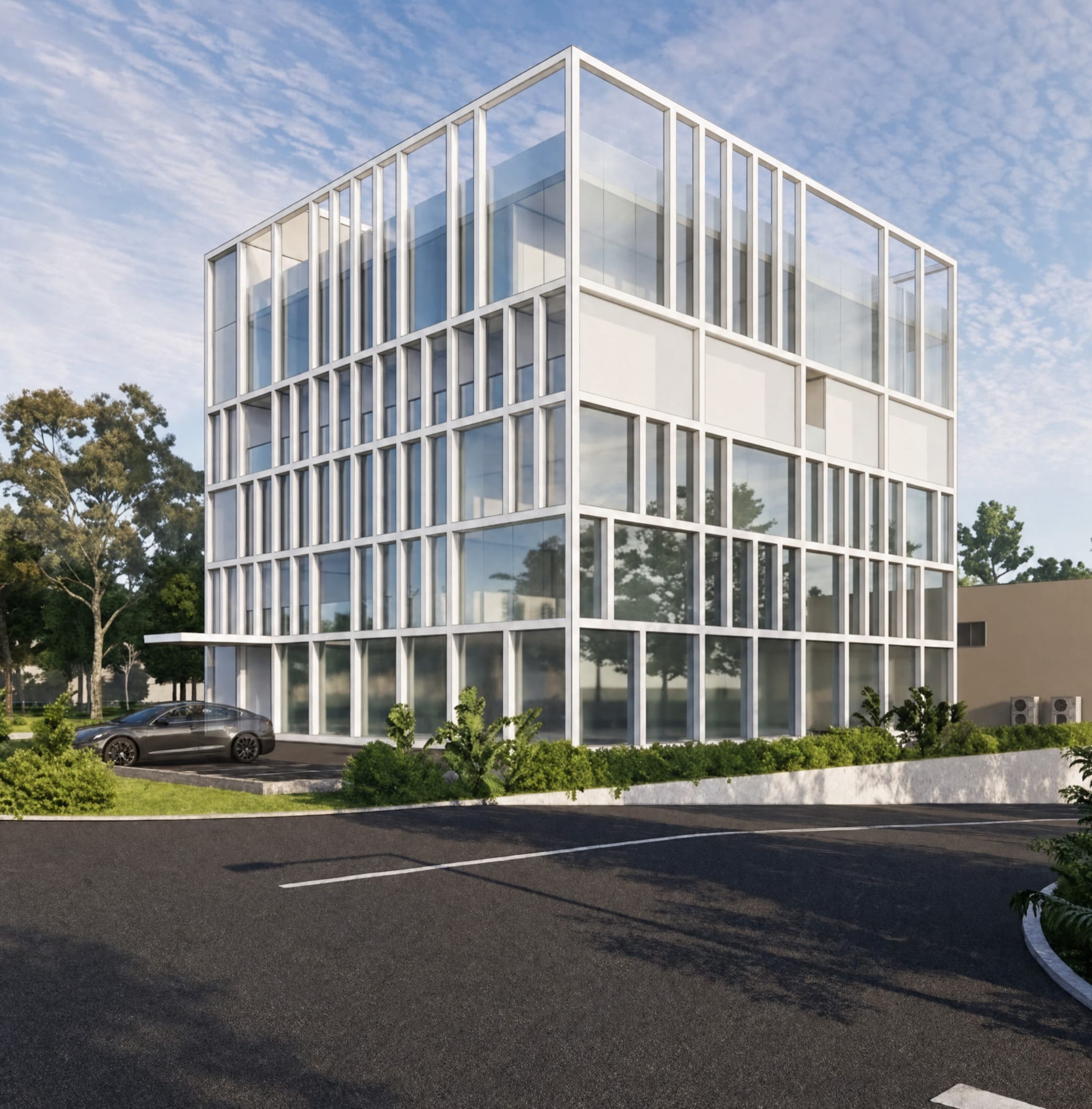 Glazed office volume wrapped in a white structural grid