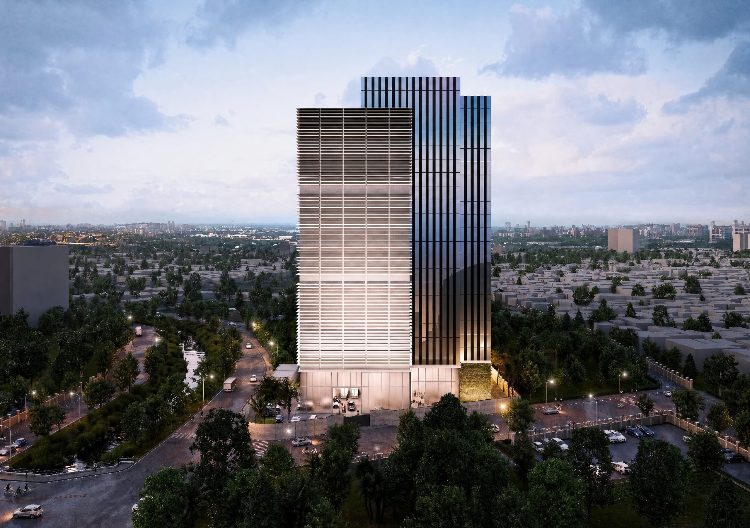 Two-tone corporate tower above a low-rise city skyline at dusk